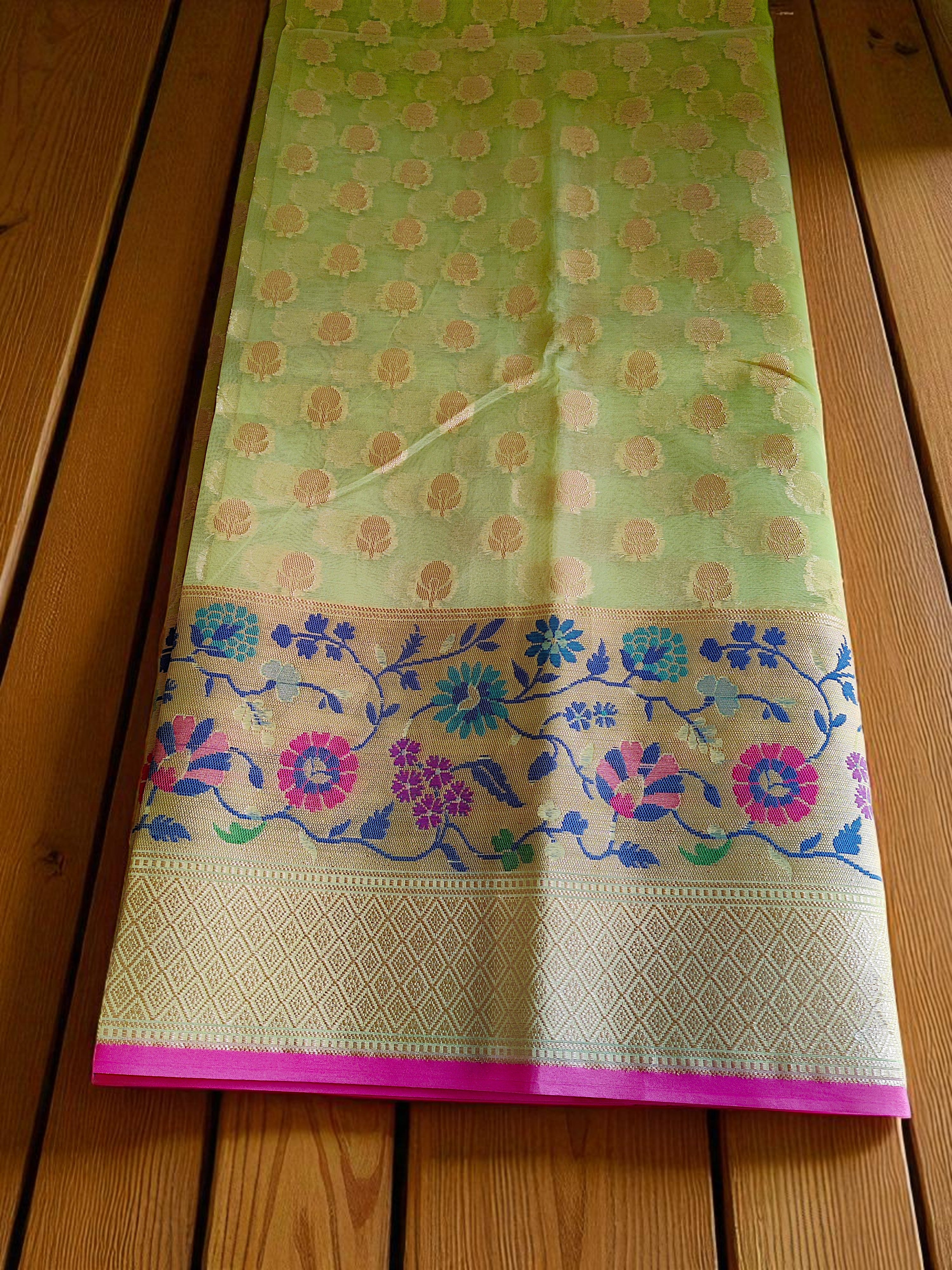 Green Banarasi Saree featuring intricate Meenakari border.